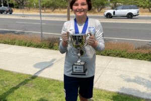 Evelyn Dickerson holding trophy.