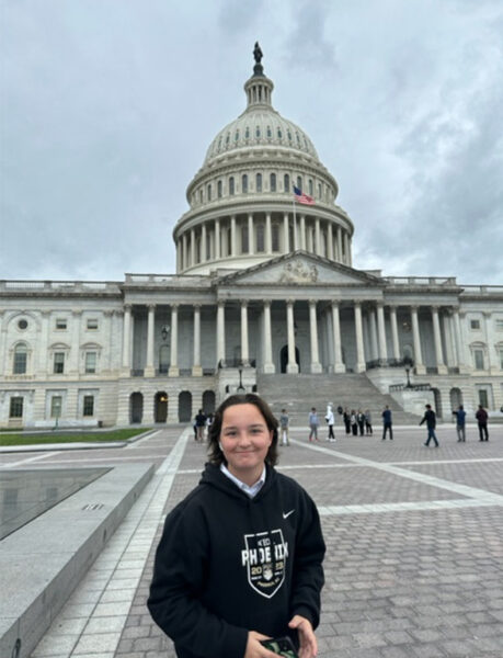 Evelyn Dickerson standing in front of U.S.. Capitol building.